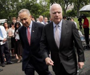 Senators Schumer and McCain walking from press conference