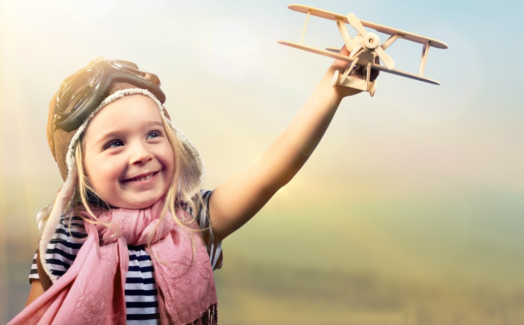 Happy child with airplane