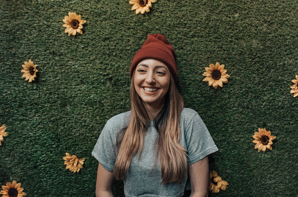 Happy girl with hat with sunflowers