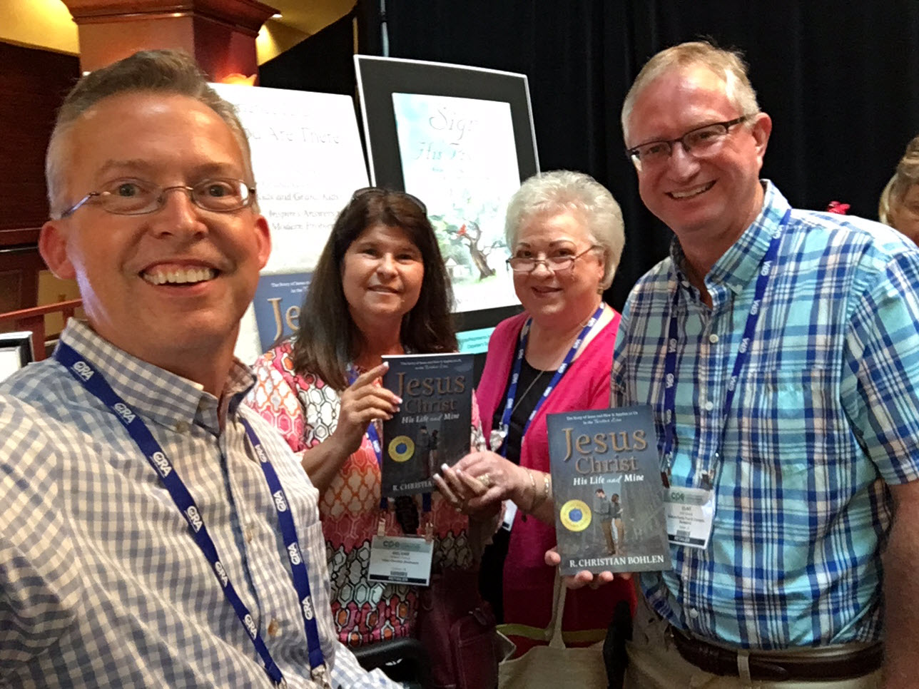 R Christian Bohlen with bookstore owners at a recent Christian book conference